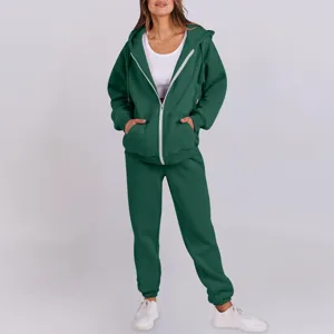 Dark green zip-up fleece hoodie and matching sweatpants tracksuit set for women.