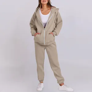 Casual khaki zip-up hoodie and sweatpants set detail, soft fabric texture and relaxed fit.