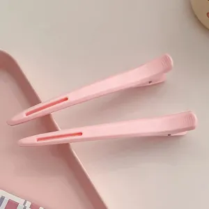 Professional hair sectioning duckbill clips, pink long hair styling clips for salon use.