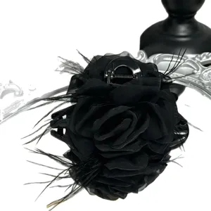 Black mesh rose hair claw clip with feather, elegant large shark clip for women styling hair.