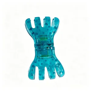 Pince à cheveux transparente bleue en plastique avec motif à pois et ressort pour coiffure.