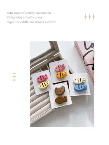 Detailed view of cute candy color taiyaki hair clips, sweet cartoon fish design for girls.