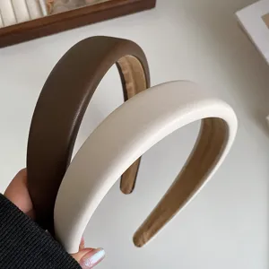 Detail view of retro wide leather headband, premium PU material chic hair accessory for women.