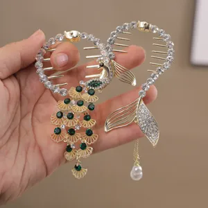 Rhinestone peacock and mermaid hair clips detail view, sparkling crystal girls hair accessories.