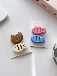Cute candy color fish hair clips detail shot, sweet cartoon hair accessories for daily wear.