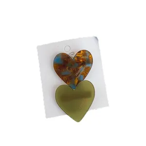 Cute double heart hair clips for women and girls, stylish acrylic side hairpins for styling.