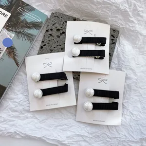 Black ribbon hair clips featuring large white pearls, elegant side bangs clip for women and girls.