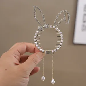 Crystal pearl rabbit ear hair claw clip for girls, elegant ponytail holder styling accessory.