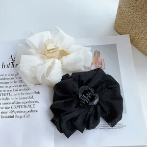 Large mesh bow hair claw clip for women, elegant black and white hair accessories.