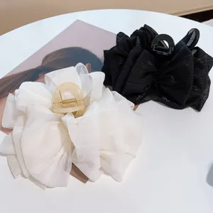 Large organza bow hair claw clip for women, stylish mesh hair catcher for thick hair styling.