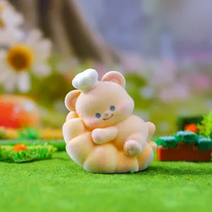 Flocked bear figurine detail shot, cute pastry design miniature desktop decoration ornament.