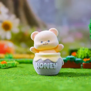 Flocked bubble bear in honey pot blind box toy cute desktop figurine decoration.