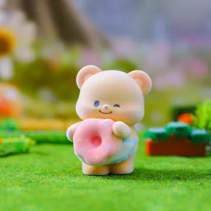 Flocked cute bear blind box figurine holding a pink donut for desktop decoration and gifts.