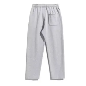 Close-up detail view of the grey casual trousers highlighting the back pocket and elastic waist.
