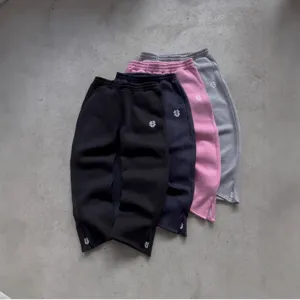 High street casual sweatpants with zipper cuffs and stylish embroidery for men and women.