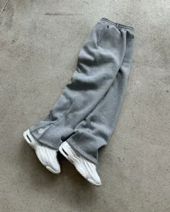 High street casual grey sweatpants with ankle zippers and custom embroidery detail for men.