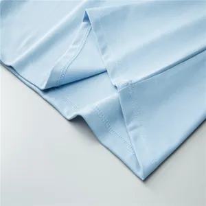 Light blue polo shirt fabric detail showing breathable mesh texture and neat stitching.