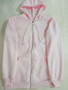 Pink full-zip hoodie detail showing soft fabric, adjustable drawstring hood, and front pockets.