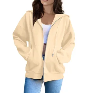 Casual oversized zip-up hoodie for women, featuring a comfortable hooded design and pockets.