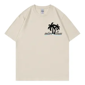 Beige short sleeve t-shirt with palm tree graphic and casual round neck for women.