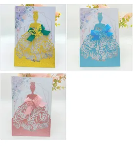 Elegant laser-cut wedding invitation cards in gold, blue, and rose gold colors.