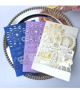 Detailed macro view of laser-cut invitation cards in blue, purple, and white gold