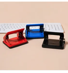 Metal double-hole paper puncher detail view, heavy-duty office document binder punch tool.