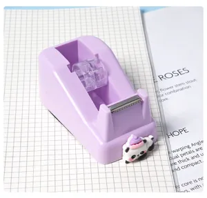 Cute purple desktop tape dispenser with adorable panda figurine and sharp cutter for office.