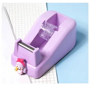 Cute purple desktop tape dispenser with cartoon milk girl figurine and metal cutter.