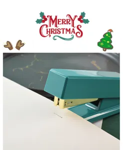 Detailed close-up shot of the luxury green office stapler binding paper smoothly and neatly.