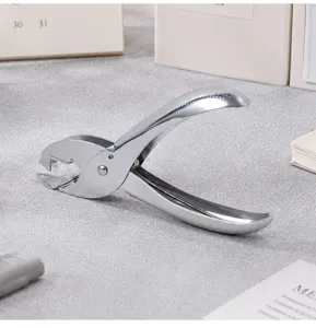 Metal manual staple remover, ergonomic office tool with triangular jaw for easy removal.