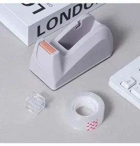 Morandi desktop tape dispenser with clear tape roll, minimalist office stationery tool.