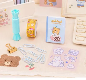 Cute cartoon bear stationery set with mini notebook tape clips and stickers for study.