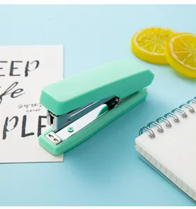 Macaron portable hand-held stapler for office and school use, compact size number 10 stapler.