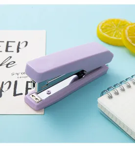 Macaron color mini stapler detail view, portable hand-held desktop stationery for office and school.