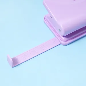 Macaron purple desktop two-hole puncher with adjustable paper size guide ruler for stationery.