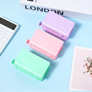 Macaron pastel color double hole puncher set for student stationery and loose-leaf binding.