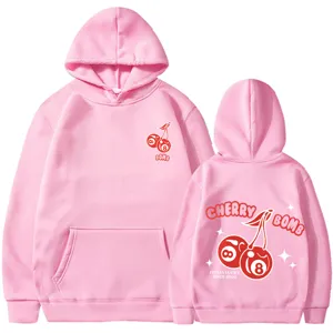 Sweat à capuche rose avec imprimé graphique cherry bomb à l'avant et à l'arrière. Style streetwear.