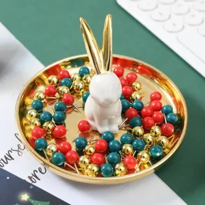Keramik Kaninchen Figur goldene Aufbewahrungsschale mit bunten Pinwandnadeln Hauptansicht
