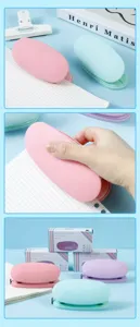 Macaron color double hole puncher with soft silicone surface, cute and simple office stationery.