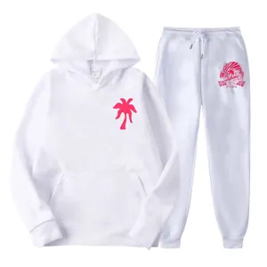 White fleece hoodie and sweatpants tracksuit set with pink palm tree print for casual wear.