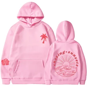 Felpa con cappuccio rosa da donna con grafica palma e design chasing sunsets sul retro.