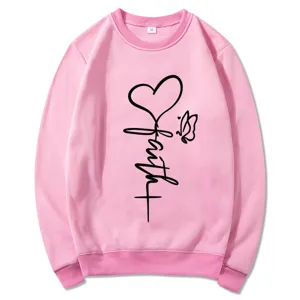 Pink long sleeve crewneck sweatshirt for women featuring faith heart graphic print casual top view