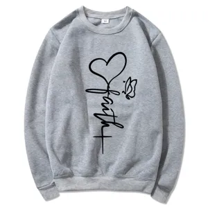 Grey crewneck long sleeve sweatshirt for women featuring a faith heart and cross graphic print.