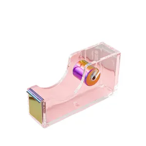 Clear pink acrylic tape dispenser with rainbow electroplated metal core and cutter blade.