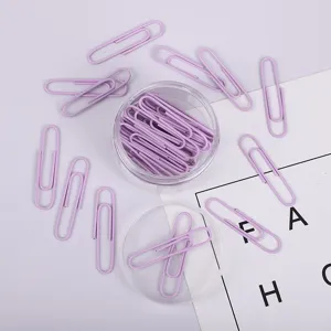 Kreative macaron lila büroklammern in klarem eimer für desktop schreibwaren organisation