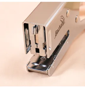 Close-up detail of the heavy-duty metal plier stapler head mechanism showing sturdy build.