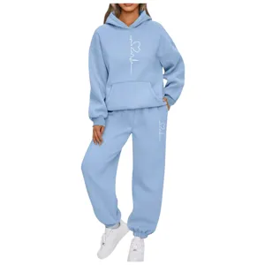 Women casual two piece tracksuit set autumn winter light blue hoodie and sweatpants with heart pattern.