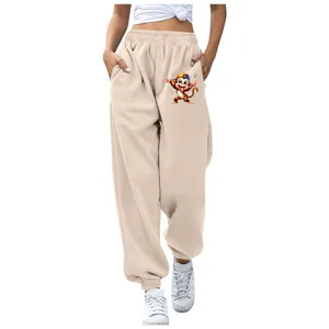 Pantaloni della tuta beige comodi e larghi con simpatico motivo a stampa di scimmia.
