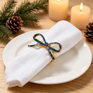 Metal enamel bow napkin ring for western table setting, elegant holiday dinner decor.